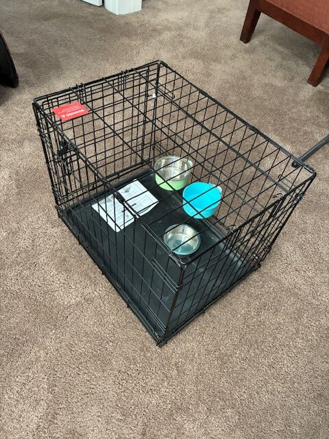 Dog crate with bowls