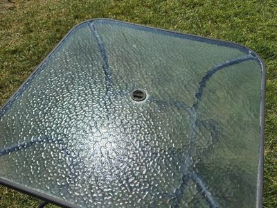 Patio Table and Umbrella Set Glass Top Table with Tropical Leaf Canopy