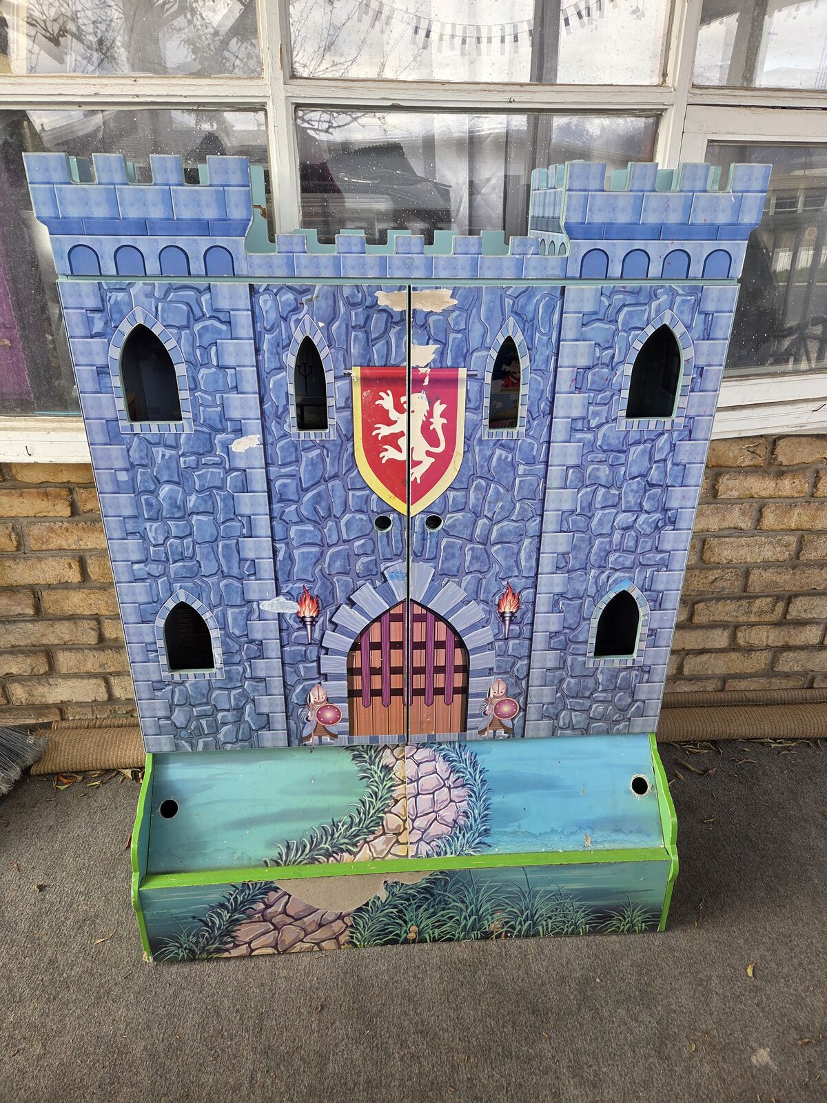 Winland Knight Wooden Medieval Castle Play Set, which also functions as a bookshelf and toy box.