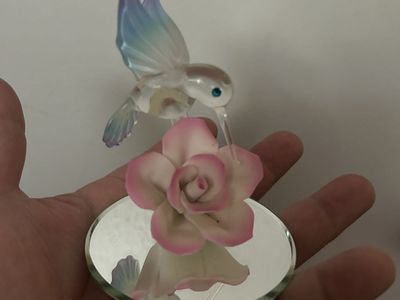 Hummingbird with pink rose