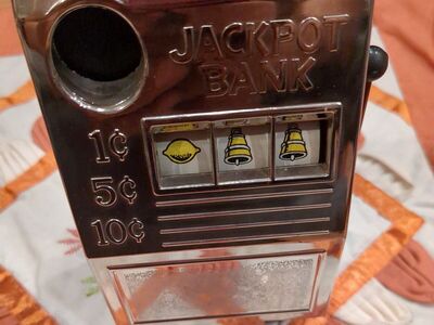 Vintage metal Western cowboy slot machine