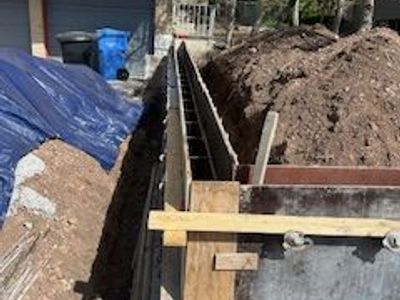Concrete Foundations | Footings | Stem Walls | Walkout Basements | Concrete Slabs | Foundation Contractor