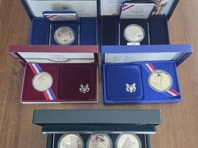7 different 90% Silver commemorative Dollars
