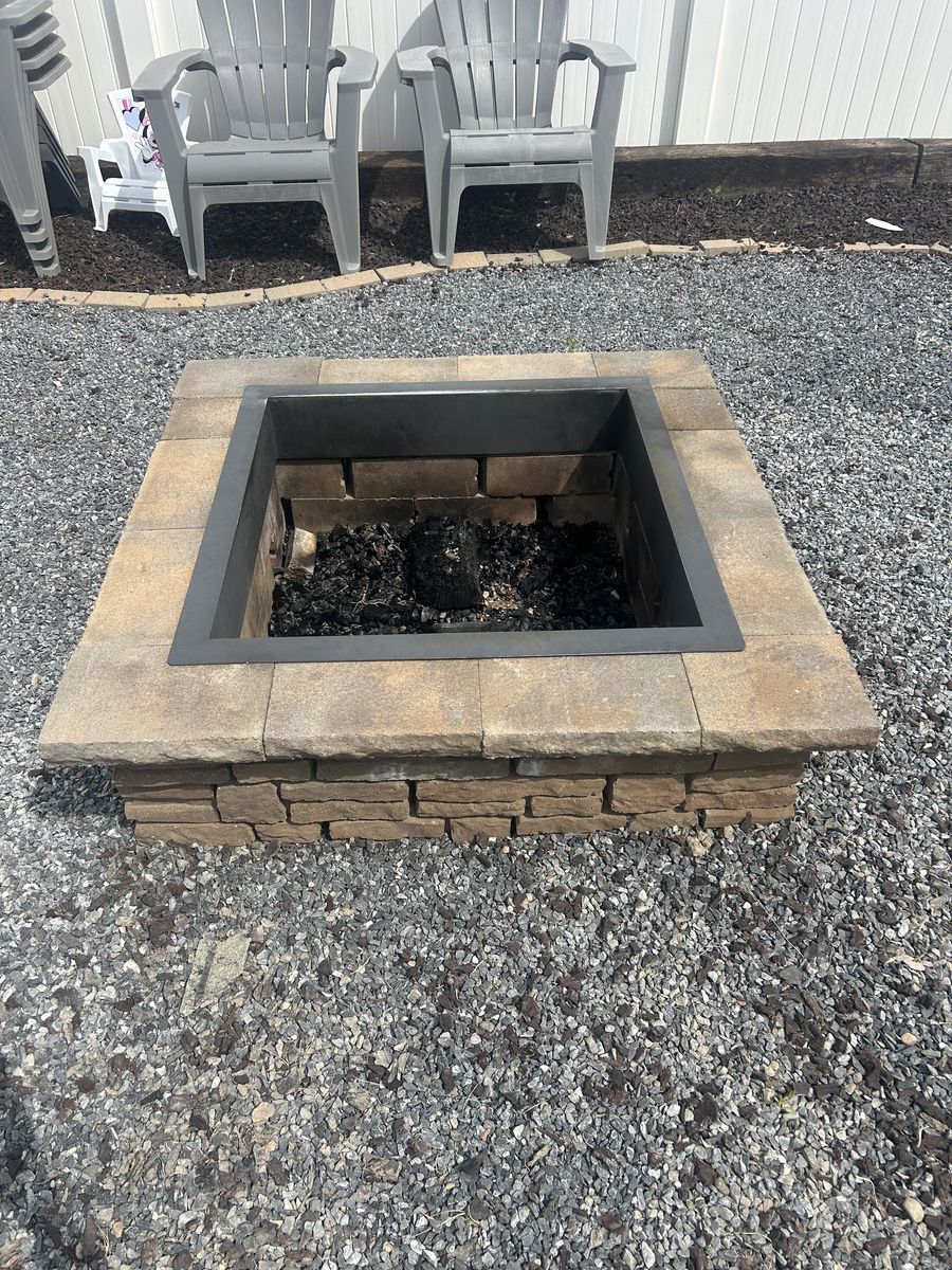 Square brick outdoor fireplace