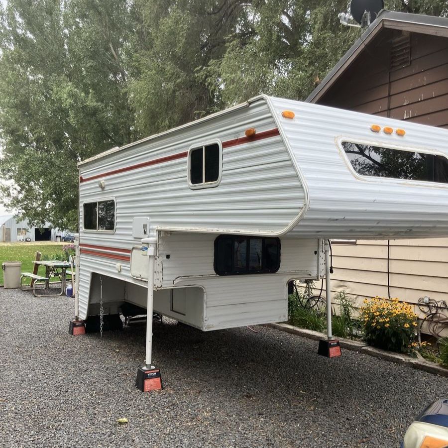 Used Truck Camper with Full Kitchen, Bathroom, and Overhead Bed Interior