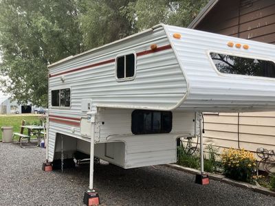 Used Truck Camper with Full Kitchen, Bathroom, and Overhead Bed Interior