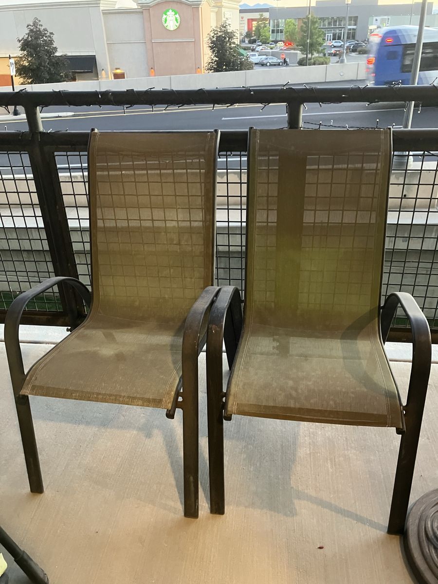 2 Used stackable patio chairs. Dark Green