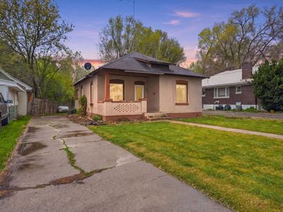 FIXER-UPPER OPPORTUNITY WITH CLASSIC CHARM!