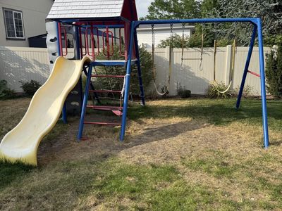 Used Outdoor Kids Playset with Slide, Swings, and Climbing Wall - Red, Blue, and White