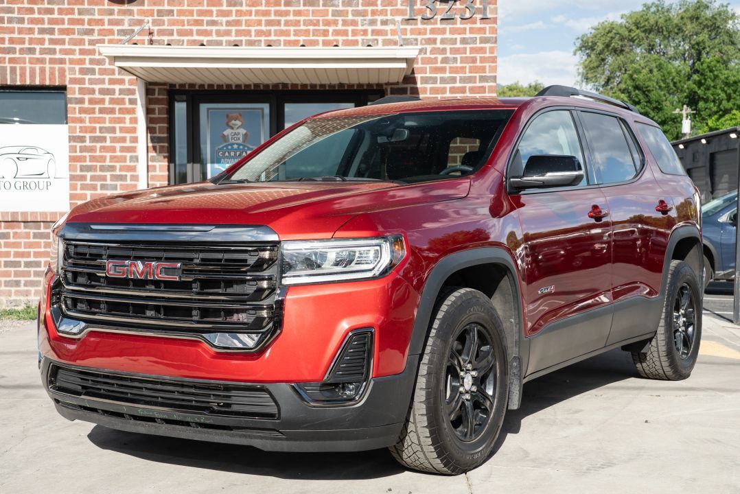 2023 GMC Acadia AT4 — rebuilt & branded title, 18% below market