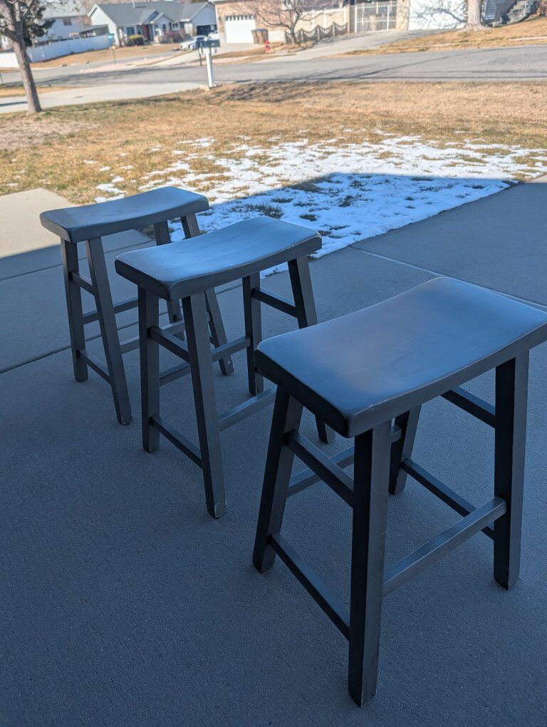 3 gray kitchen stools