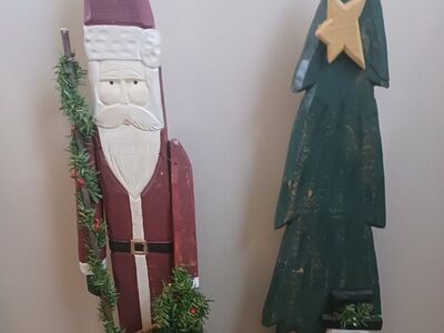 large wooden Santa and Christmas tree