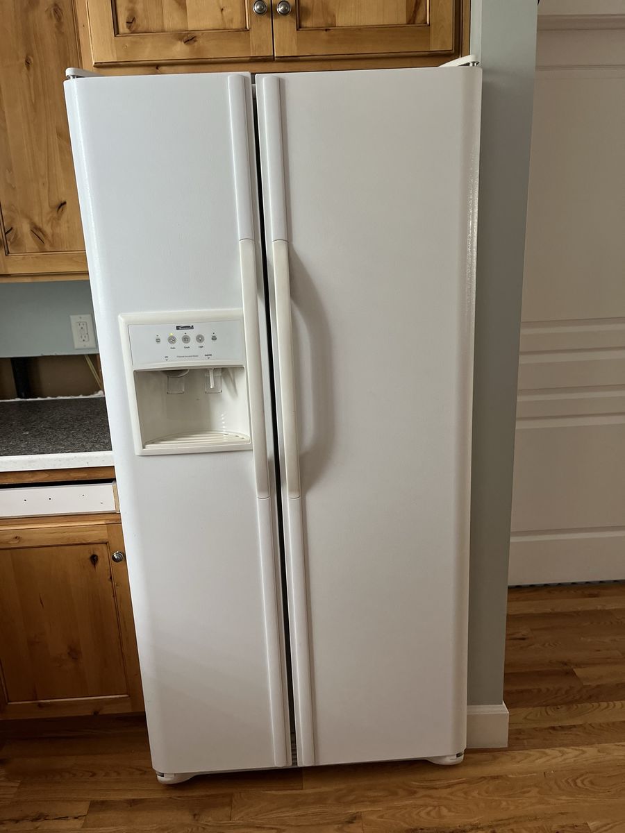 White Whirlpool Side-by-Side Refrigerator with Ice & Water Dispenser