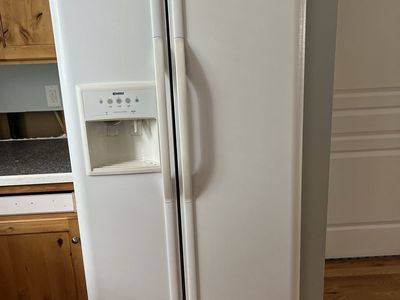 White Whirlpool Side-by-Side Refrigerator with Ice & Water Dispenser