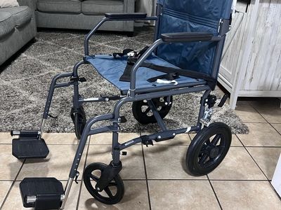 Medline Lightweight Transport Wheelchair with 12" Rear Wheels and Swing-Away Leg Rests