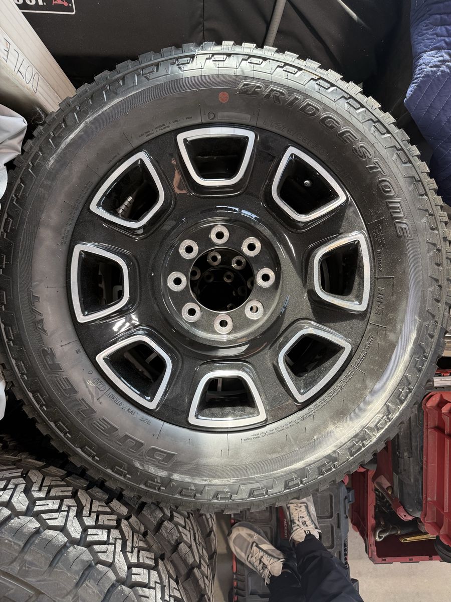 Four 275/75R20 Bridgestone Tires With Wheels