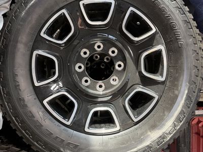 Four 275/75R20 Bridgestone Tires With Wheels