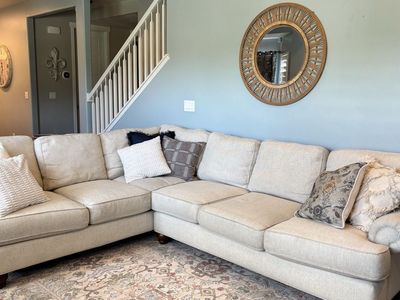 Large 2 Piece Cream-Colored Custom Sectional Couch with Rolled Arms and Wooden Feet - Good used Condition