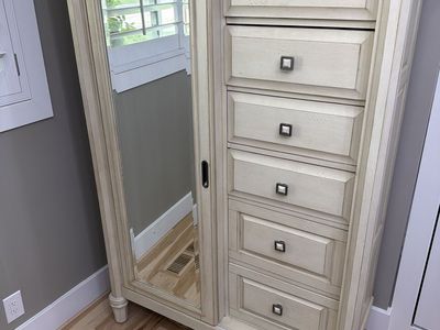 Armoire with sliding mirror