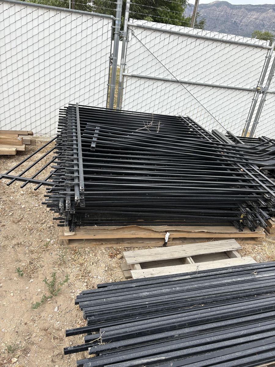 Used black iron fence panels.