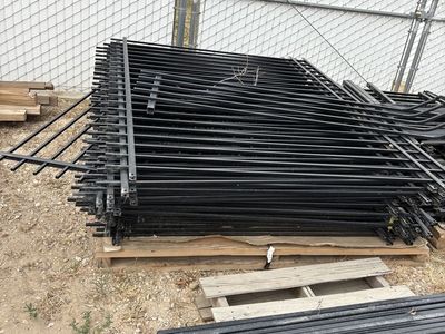 Used black iron fence panels.