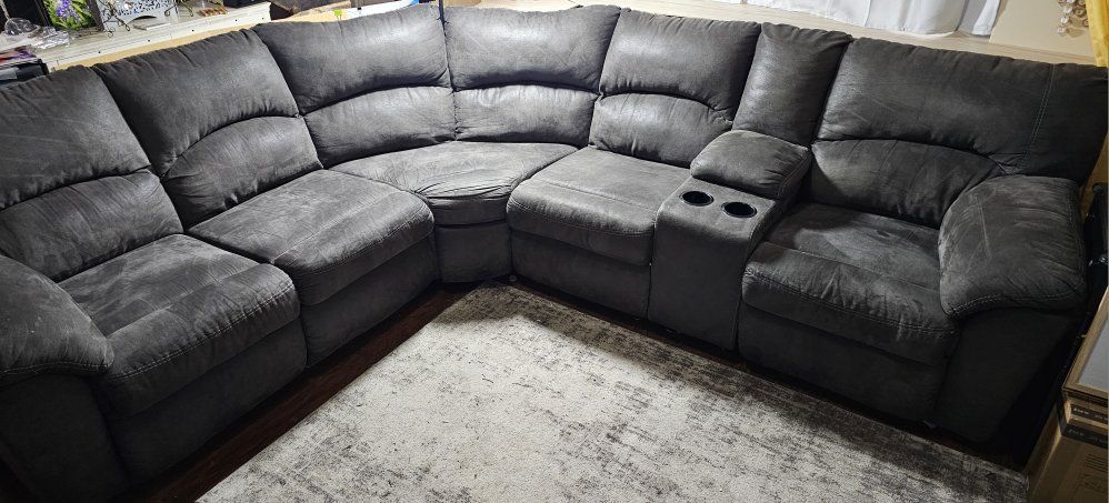Dark gray sectional with possible delivery