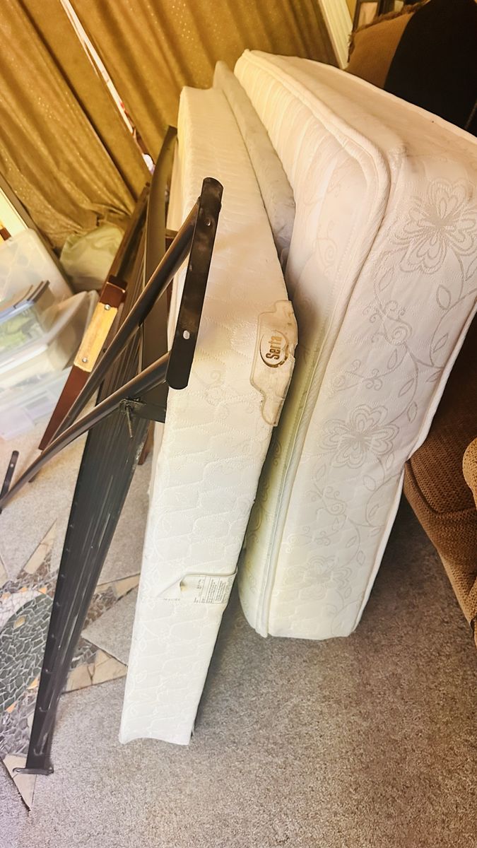 Free Twin size bed frame. Selling newer serta mattress