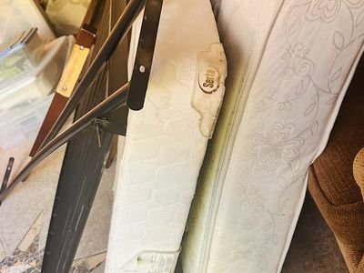 Free Twin size bed frame. Selling newer serta mattress