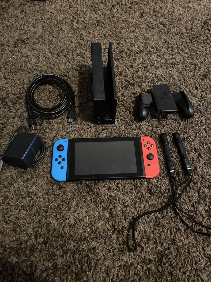 Nintendo Switch Console V1 with Joy-Cons (Blue/Red), Dock, Grip & Power Supply (Used)