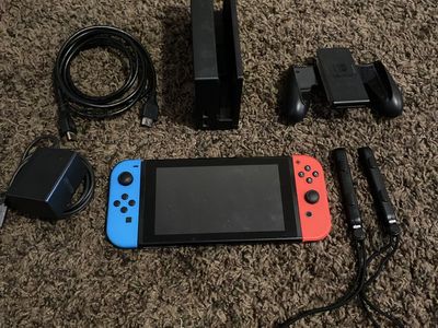 Nintendo Switch Console V1 with Joy-Cons (Blue/Red), Dock, Grip & Power Supply (Used)