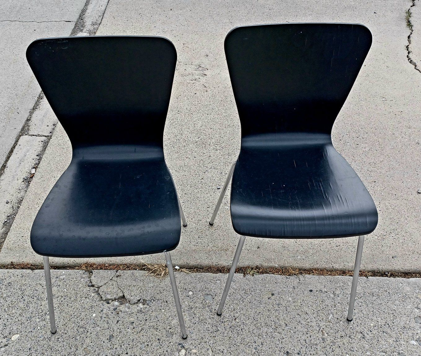 Set of 2 Black Chairs with Metal Legs - Scratches present. The legs were somewhat bent when purchased and have been straightened