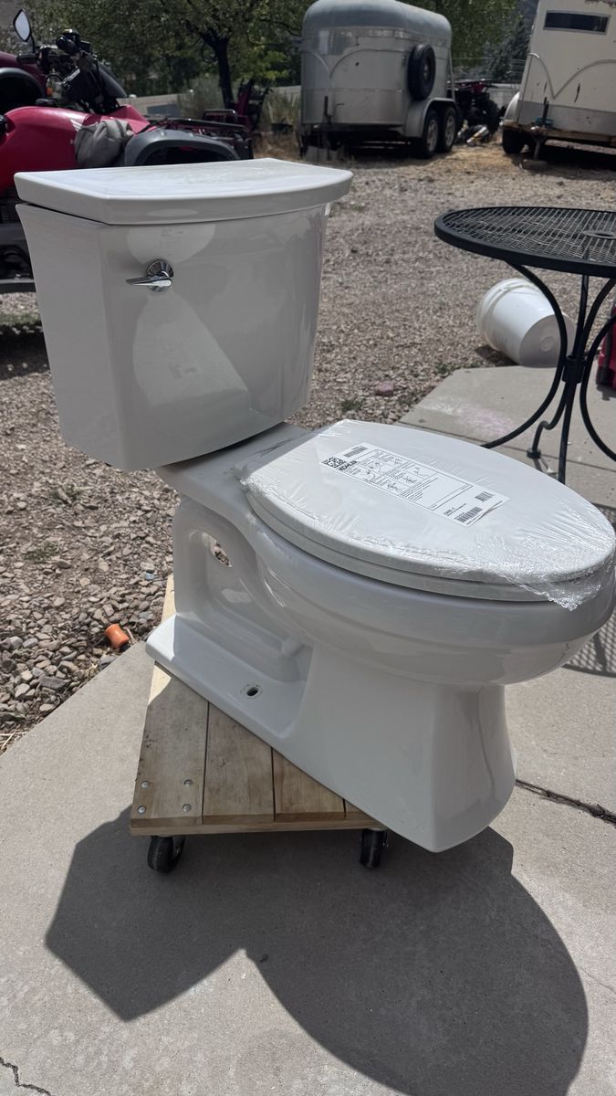 Kohler White Two-Piece Toilet with Seat - used toilet, new seat 10” rough out