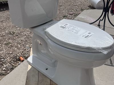 Kohler White Two-Piece Toilet with Seat - used toilet, new seat 10” rough out