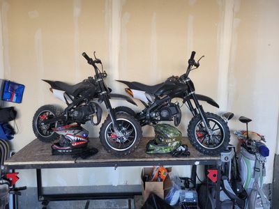 2 kids dirtbikes/helmets/gear