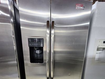 NICE GE STAINLESS STEEL SIDE BY SIDE FRIDGE! WITH A FULL WARRANTY
