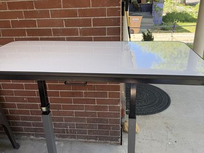Adjustable standing desk with white board top
