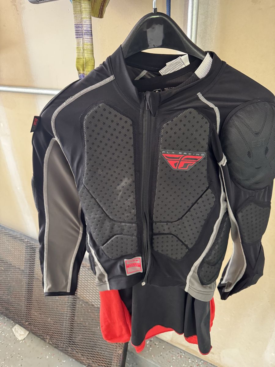 Youth riding gear, padded top plus jersey and riding pants.
