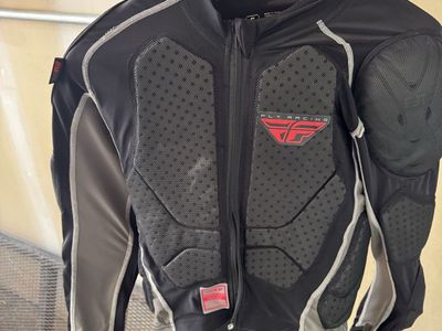 Youth riding gear, padded top plus jersey and riding pants.