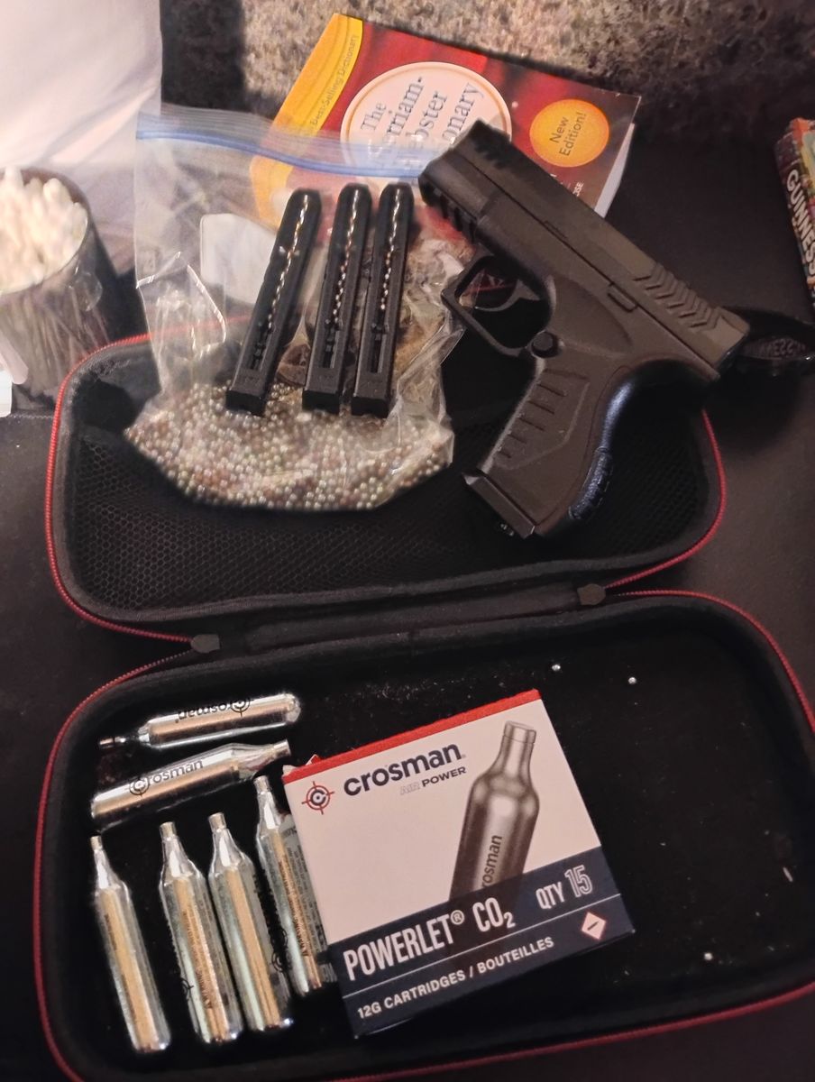 This is a  .177 caliber some ammo 21 air tanks and three clips 19 round capacity  in a zipper case