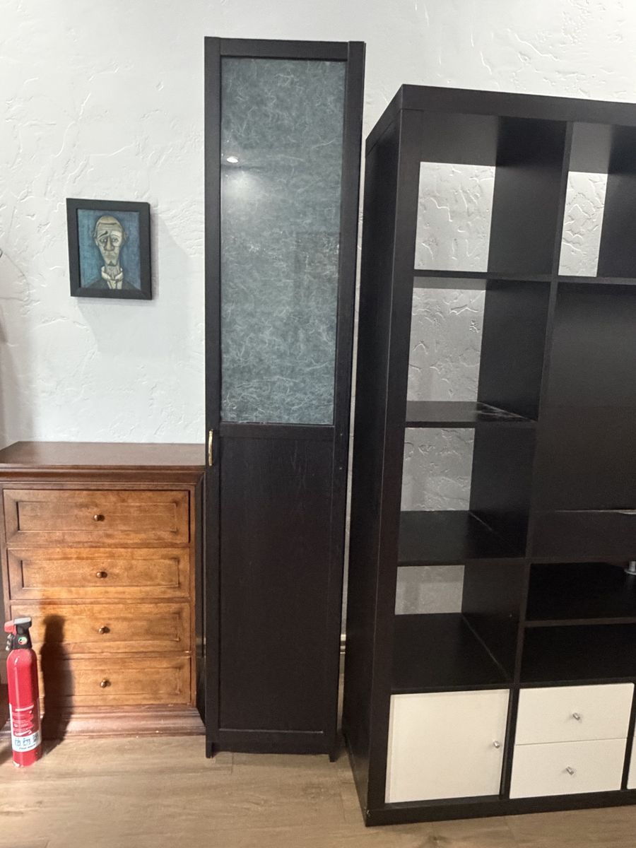 Tall Dark Wood Tone Storage Cabinet with Glass Door and Shelves