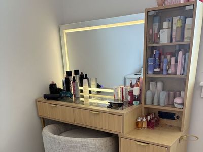 Lighted Light Wood Vanity With Fluted Details