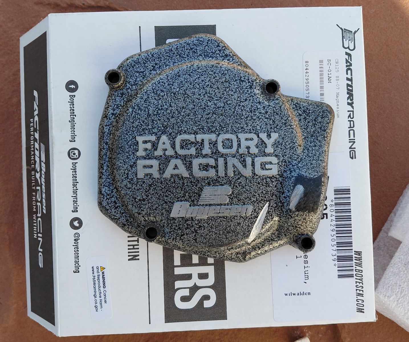 Boyesen magnesium stator cover and stock oem clutch cover for a '98-'99 Honda CR125r