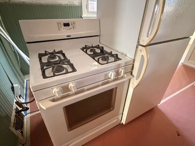 Gas range and refrigerator