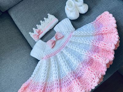 Pink and white crochet baby dress set with a hat and shoes