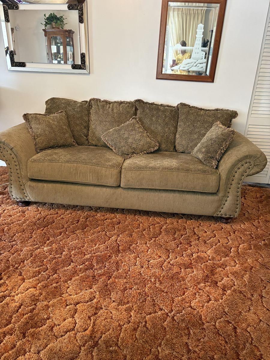 Brown Corduroy Sofa with Rolled Arms and Fringe Accent Pillows