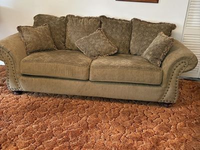 Brown Corduroy Sofa with Rolled Arms and Fringe Accent Pillows