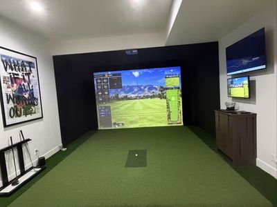 Full Indoor Golf Simulator Setup with Impact Screen and Projector