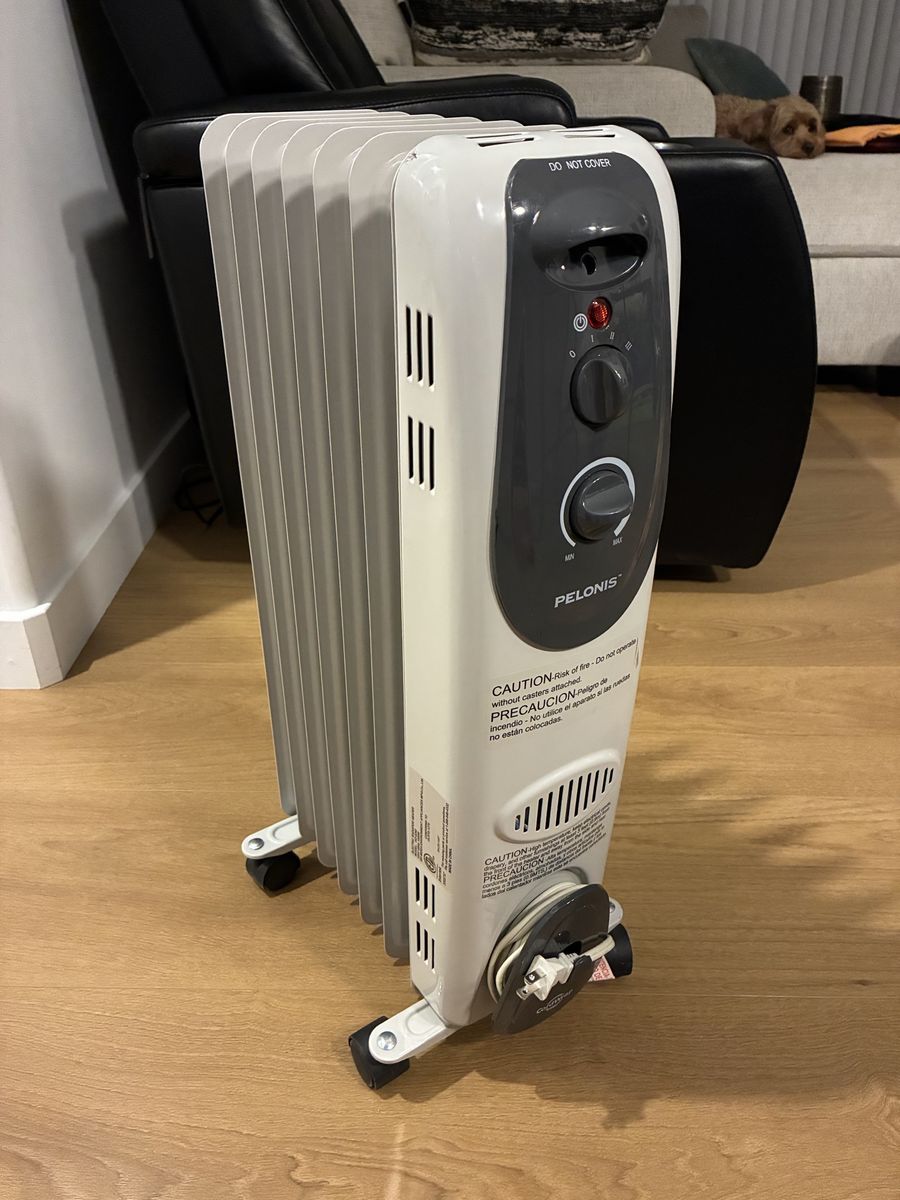 Pelonis Oil-Filled Radiator Space Heater with Adjustable Thermostat and Wheels, White