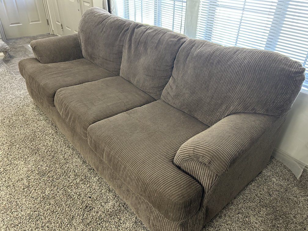 Couch in Corduroy Pinstripe Material 
Matching arm chair listed separately.) 
(89”l X 38”w) - $100