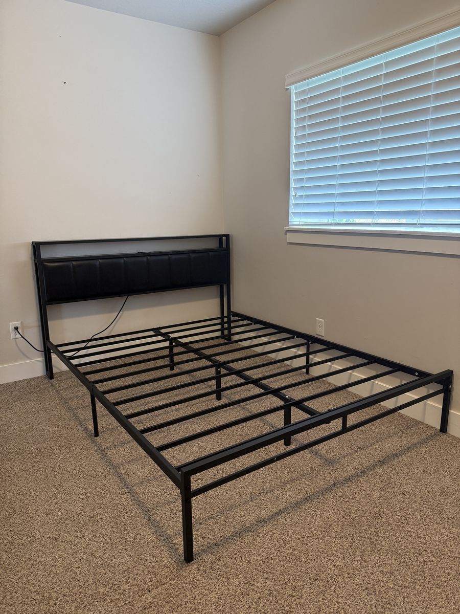 Queen black metal bed frame with storage and LED strip in headboard